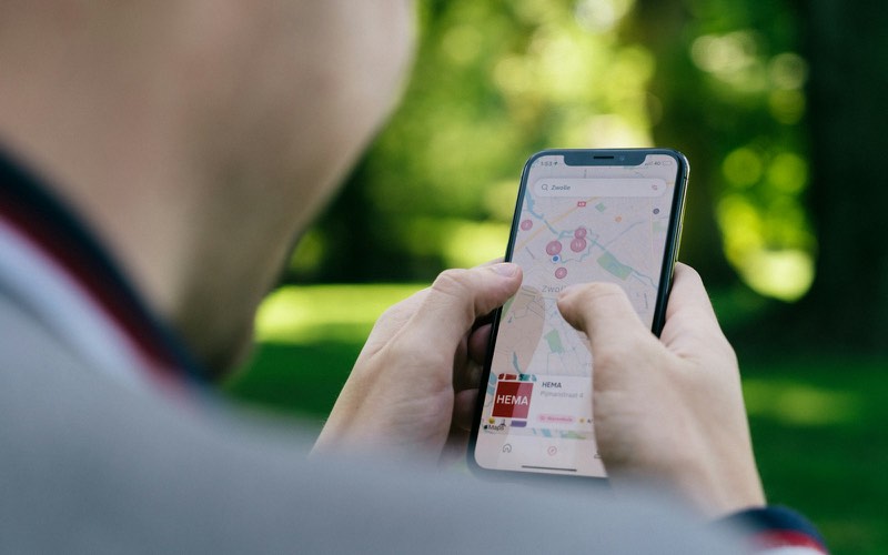 Traveler comparing options on a phone map