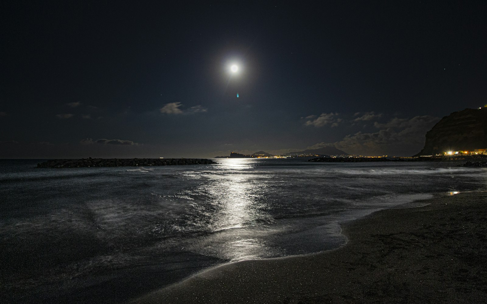 Moonlit beach at night — when the booking messages arrive